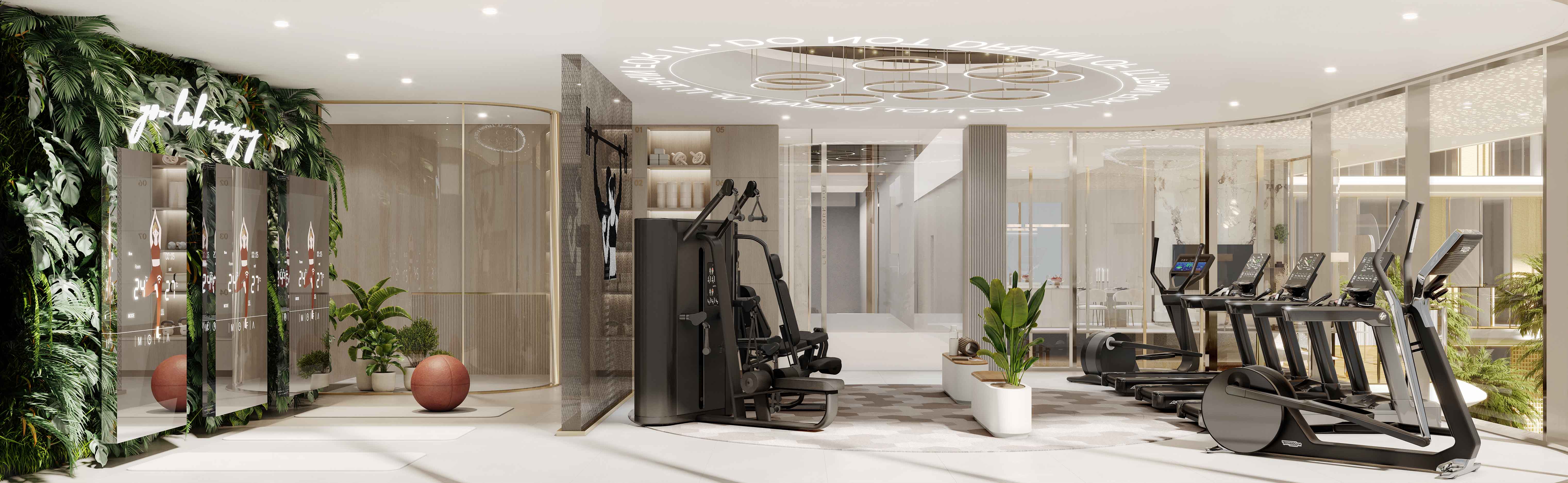 Cotier House 2 By Imtiaz Modern fitness room featuring exercise equipment, greenery, and mirrors with digital displays in a bright ambiance.
